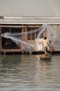 Fisherman throwing his net