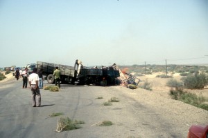 burning trucks on the road to Kashgar