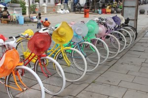 jolly-coloured bicycle rental, complete with coloured hat or helmet: you cannot get more Dutch, neither colonial!