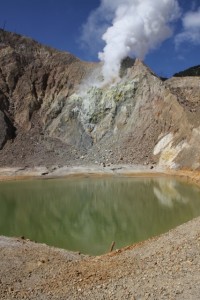and a little further, the serene green lake of the 2002 mini-crater, with plume