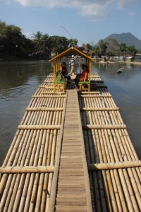 the raft has a re-inforced walkway from front to back, and a little shelter for passengers