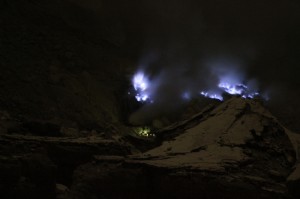 blue fire at various spots in the crater, surrounding the yellow mining spot