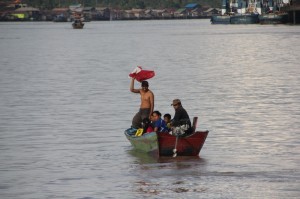 more passengers, joining the kapal biasa mid-river