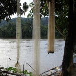 fishing nets drying along the river bank in Long Bagum