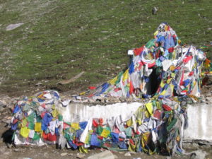 Buddhist prayer flags start appearing along the road (courtesy Gijs Remmelts)