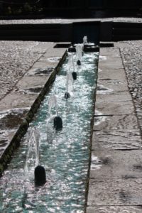 fountains and water flowing along one of the paths in Bagh-e Fin