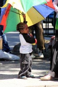 small kid, big umbrella
