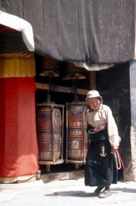 woman doing the rounds along the prayer wheels