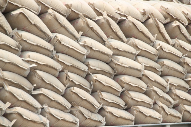 neatly stacked cement bags ready te be taken on board