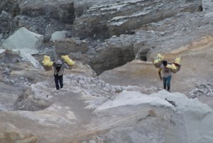 sulphur workers carrying up their loaded baskets