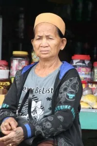 stern looking shop owner in Datan Bilang