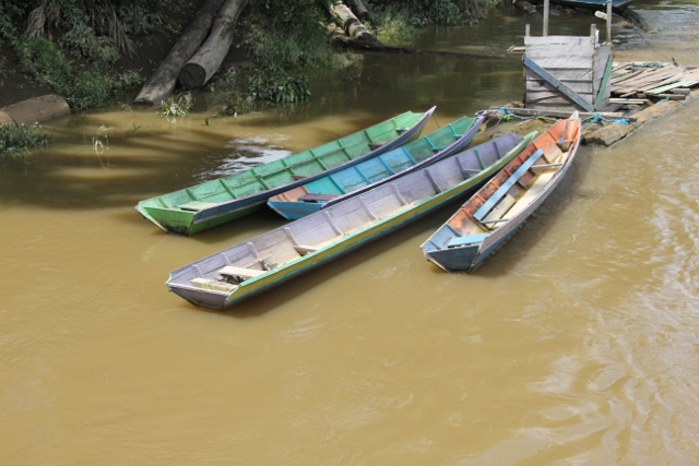 colourful canoes moored along the river