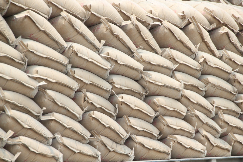 neatly stacked cement bags waiting to be loaded