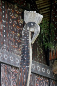 wooden cock adorning the front of a tongkonan