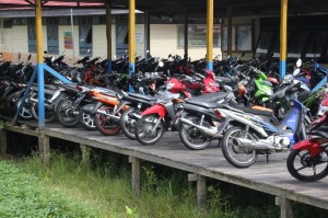 motorbikes parked in front of the local school complex