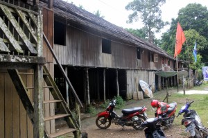 the longhouse, adapted to modern times, including motorbikes and satellite dishes