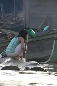 girl washing near the market