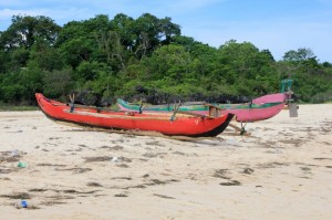 fishing canoes pulled up onto the beach