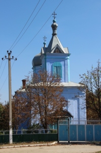 the blue church in a rural village