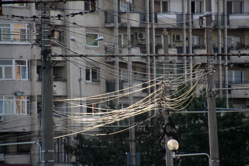 cables in Ploiesti still mostly run outside, in between poles