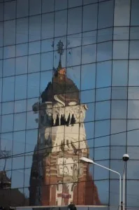 the church, reflected in a modern office building