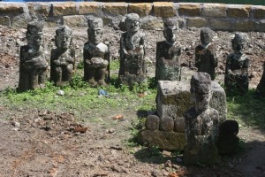 a circle of stone sculptures in the royal cemetary of Tomok