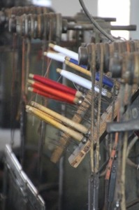 coloured silk threads on a weaving machine in the Margilan silk factory