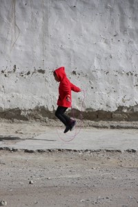 girl playing in the afternoon sun in Karakul