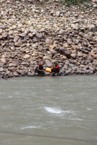 two Afghan women on the far side of the Panj River