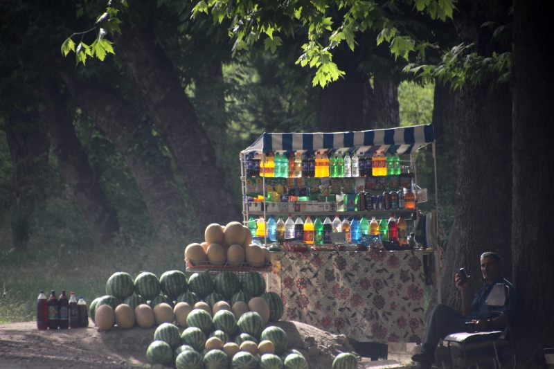 vendor selling drinks and melons along the road