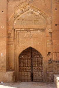 an old door, in an attractive, yet simple arch