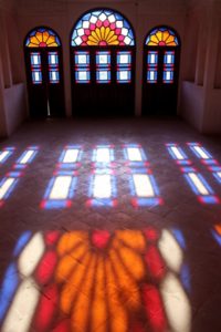 colours of stained glass projected on the floor of the Khan-e Tabatabei, one of the historical houses in Kashan